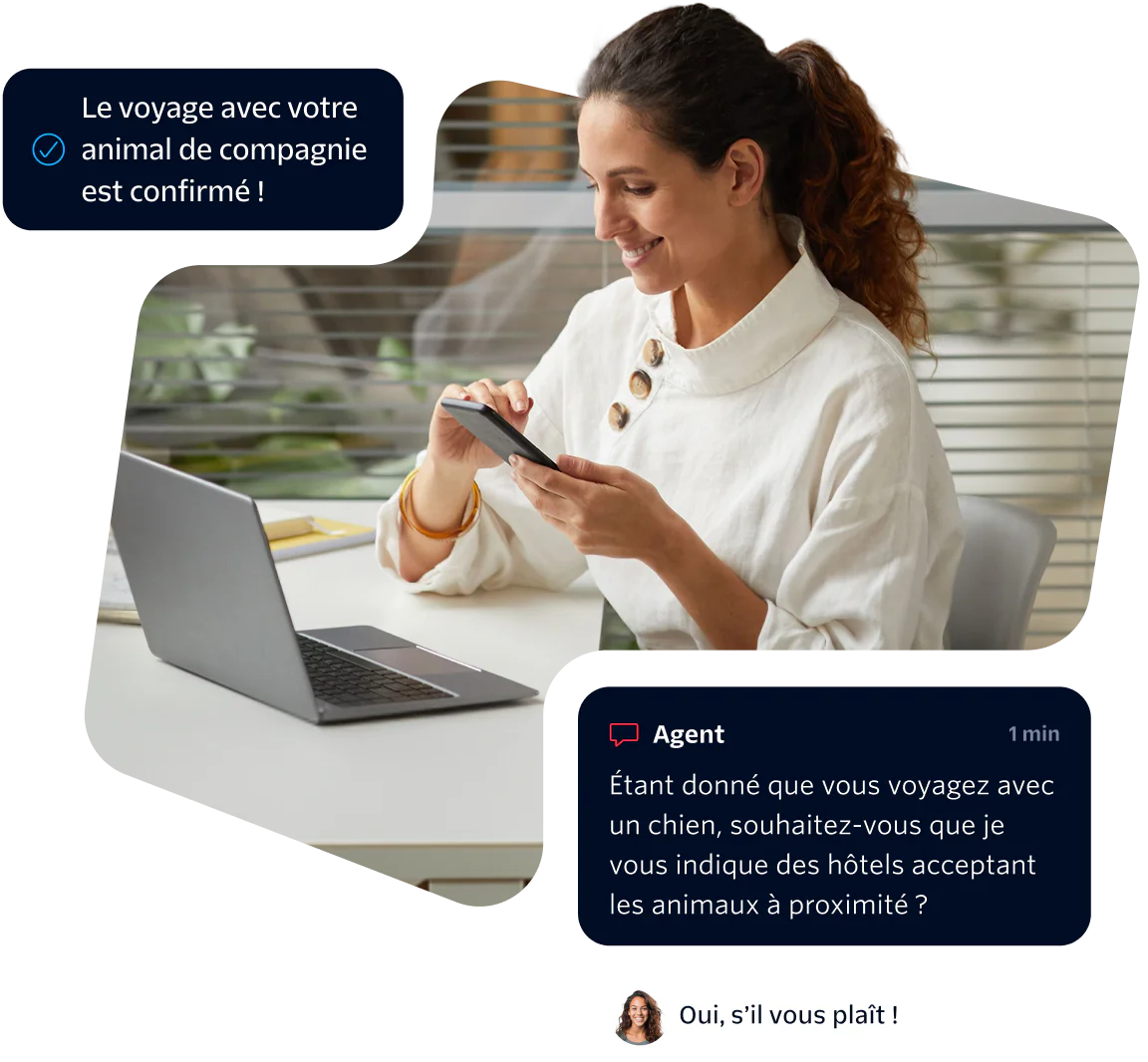 Woman using phone while chatting with virtual agent about pet-friendly hotels, laptop on desk.
