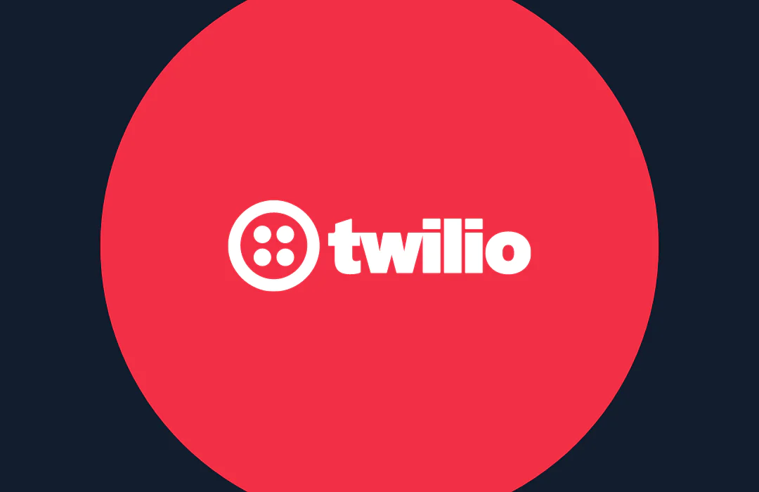 Twilio logo in white letters with a red circle background on a dark blue backdrop.
