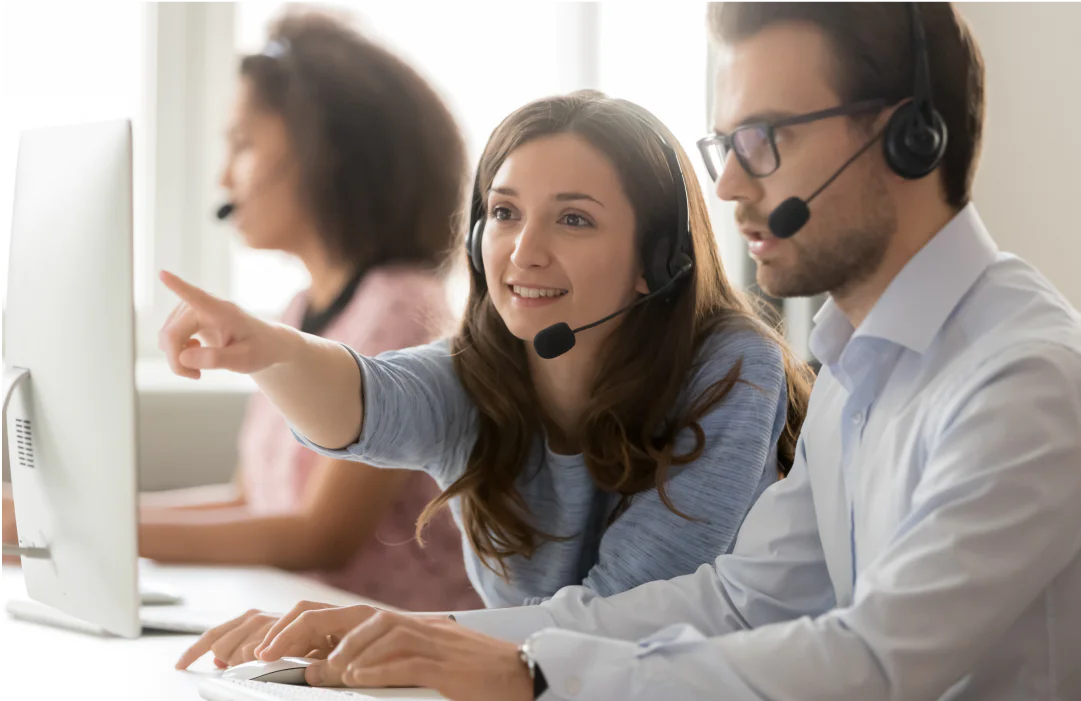Colleagues reviewing the top 5 reasons to use VoIP for a call center