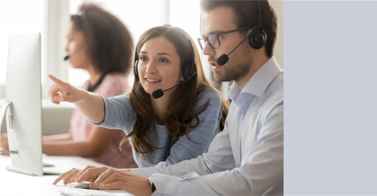 Colleagues reviewing the top 5 reasons to use VoIP for a call center