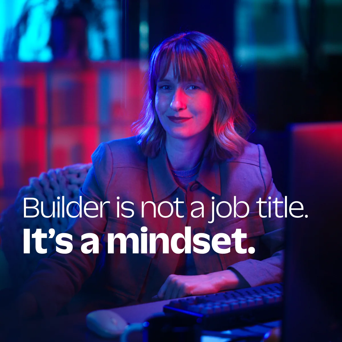 Woman in business attire with motivational text overlay about the builder mindset.