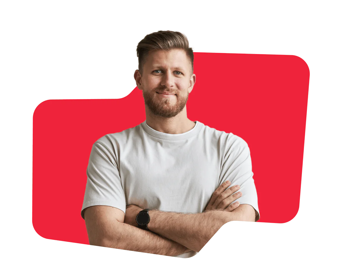 Confident Man with a Beard in a White T-Shirt Smiling man with a beard, arms crossed, wearing a white t-shirt against a red abstract background.
