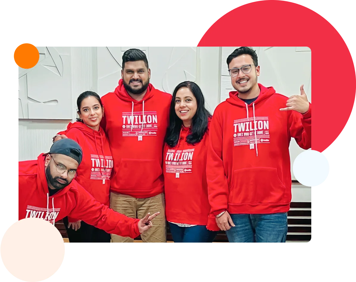 A group of Twilio employees doing jazz hands