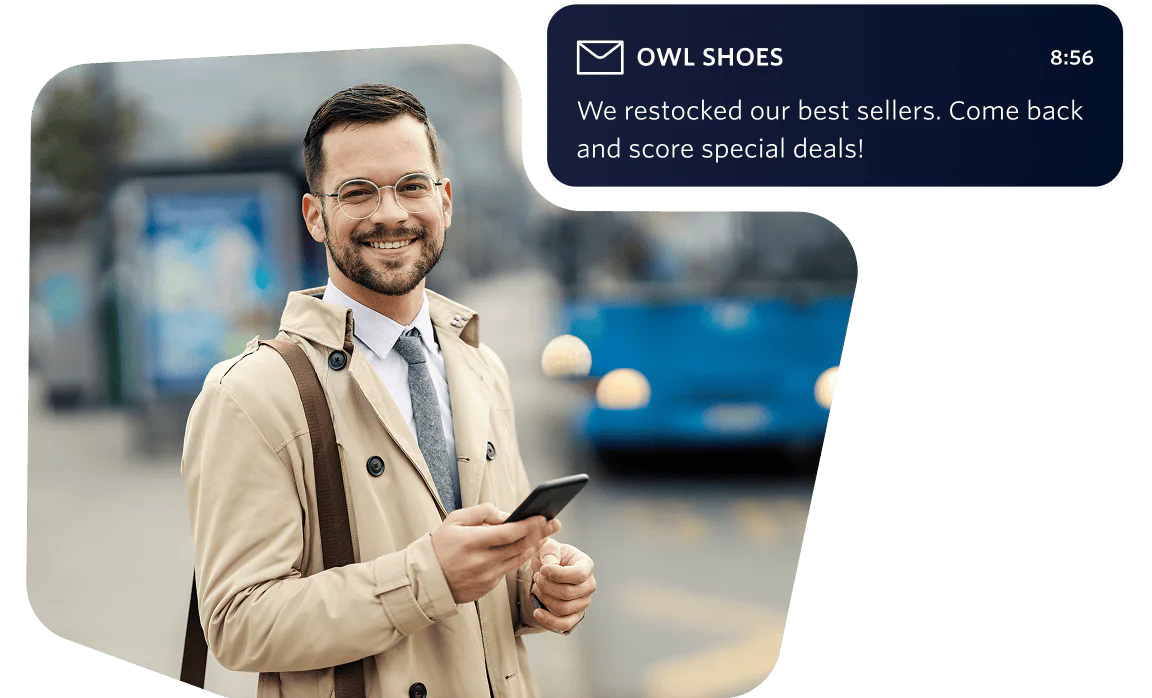 Man in a beige coat checking his phone with a sale notification. Man wearing glasses in a beige coat holding a phone, with a summer sale email notification visible.