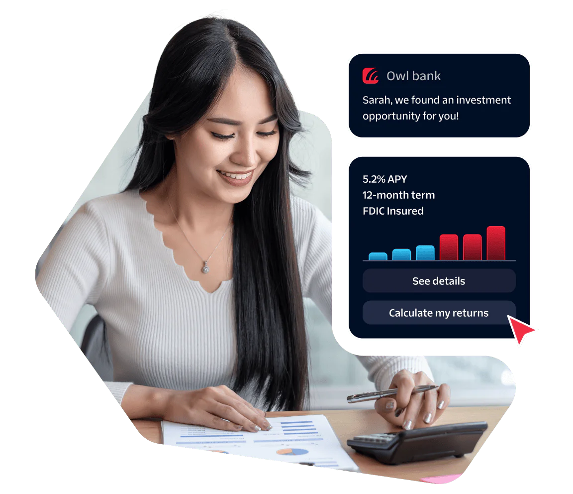 Smiling woman calculating finances with investment opportunity notification on screen.