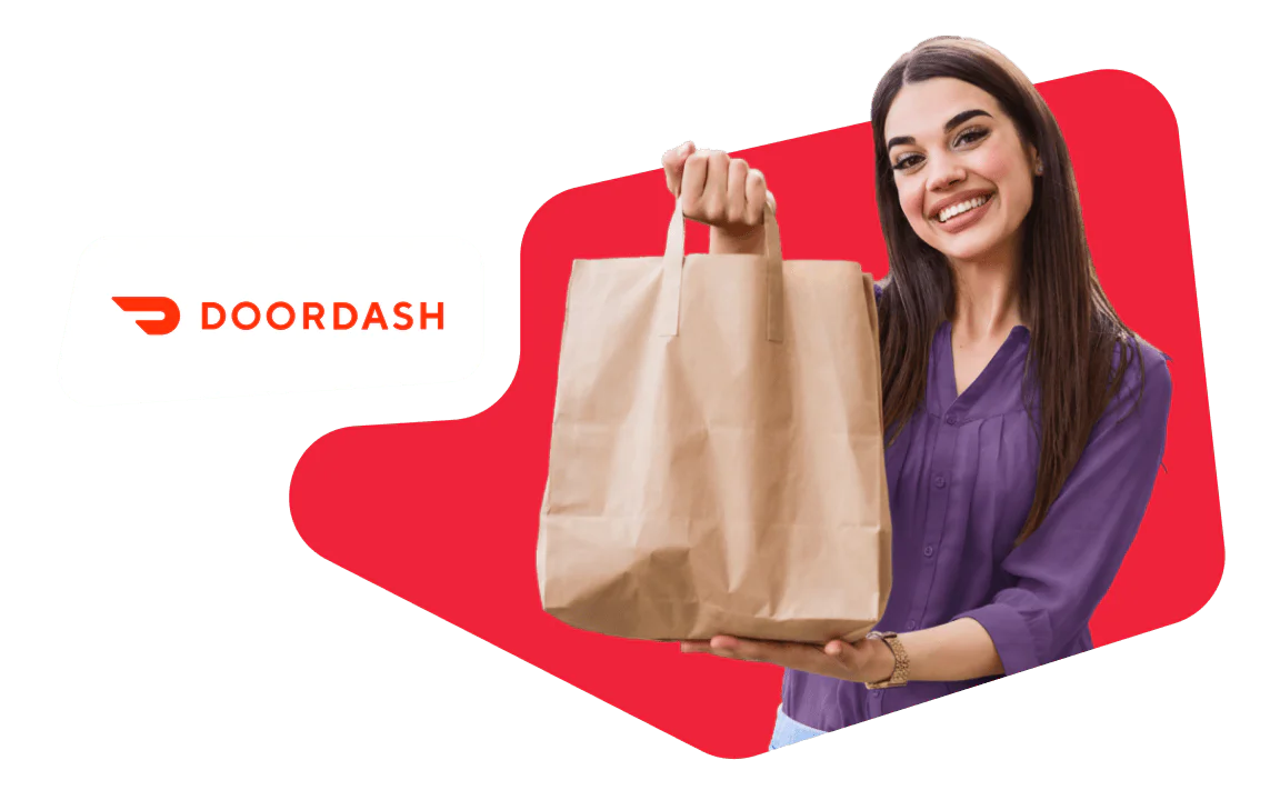 Woman Holding DoorDash Delivery Bag Smiling woman holding a brown paper bag with DoorDash logo in the background.