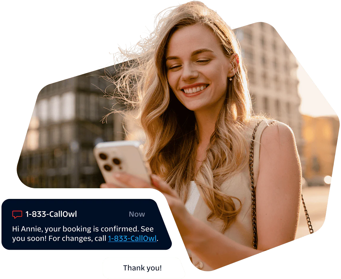 Woman Receiving Booking Confirmation on Her Phone Smiling woman looking at her phone with a booking confirmation message displayed.