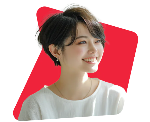 Woman with short, dark hair wearing a white blouse, smiling against a bright red background.