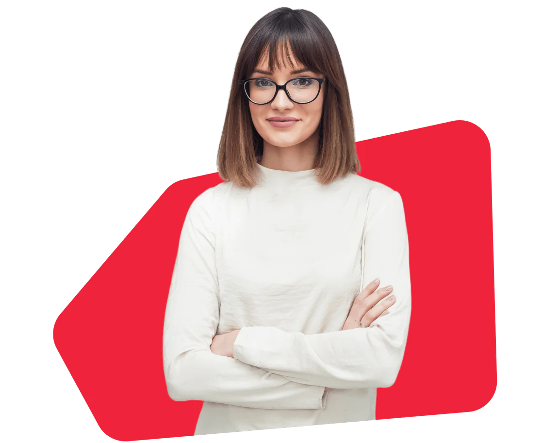 Woman with glasses and white top standing confidently with red geometric background