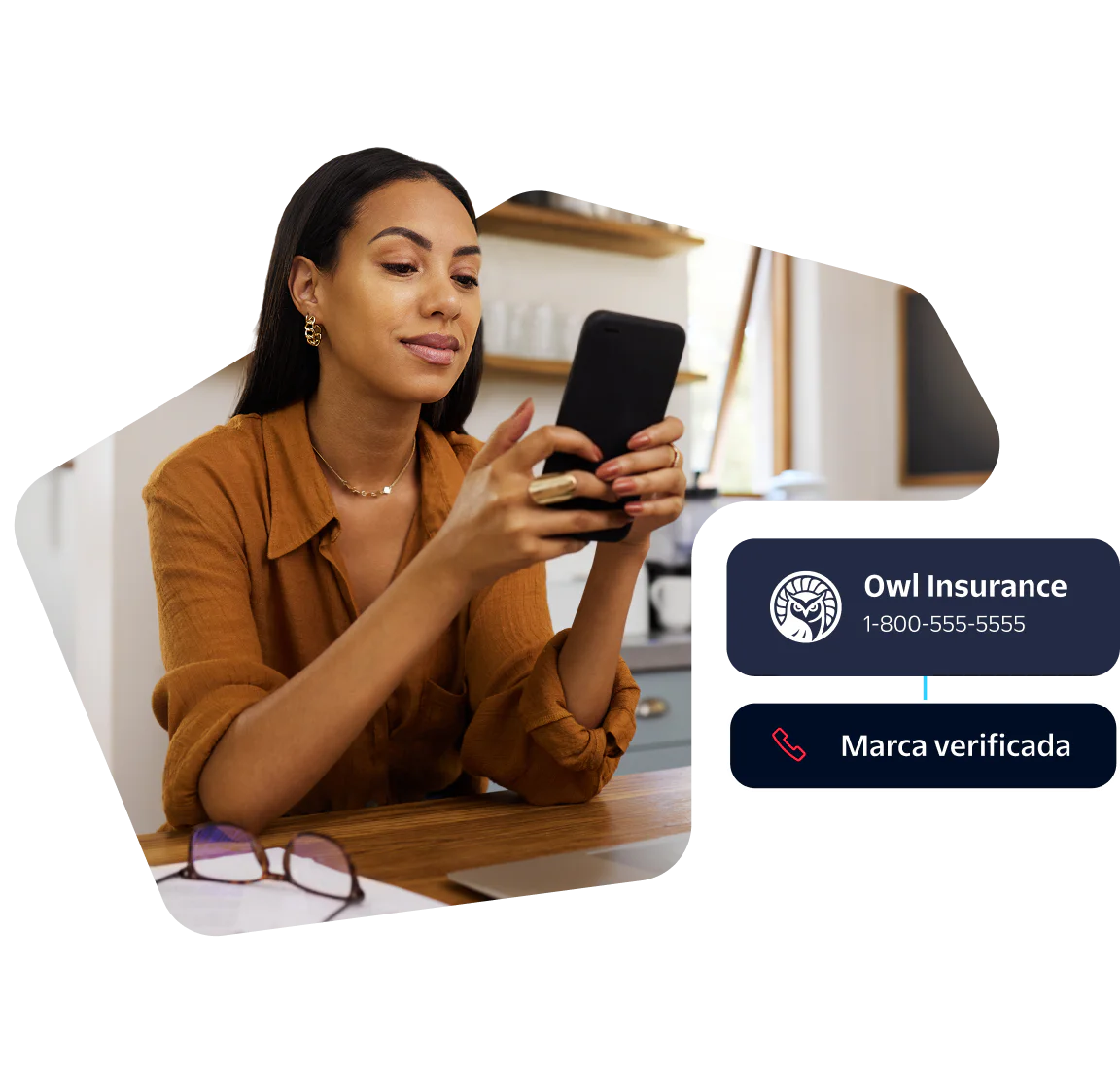 Woman in brown shirt looks at smartphone, Owl Insurance contact info displayed.