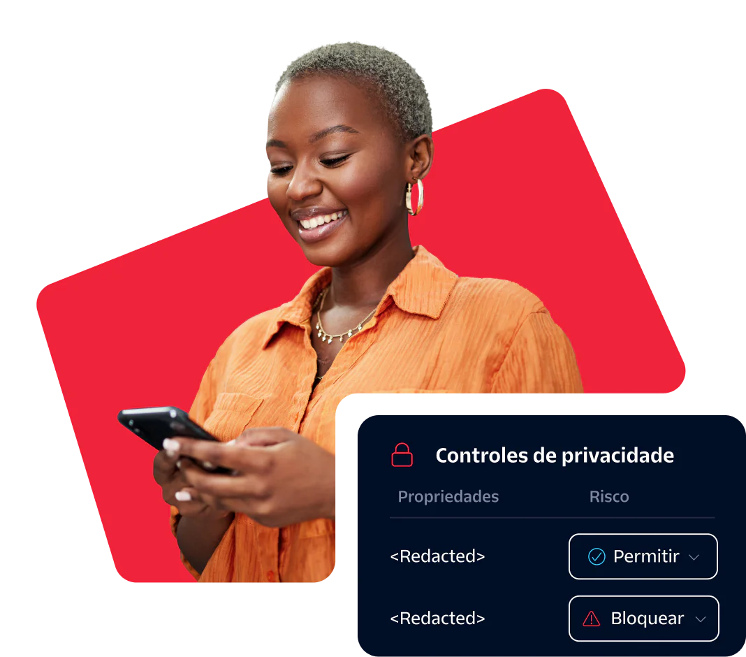 Smiling woman looking at her phone with privacy control options displayed on the screen.