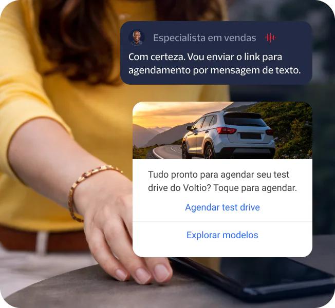 Person touching a phone with a booking link message and a car demo drive scheduling prompt.