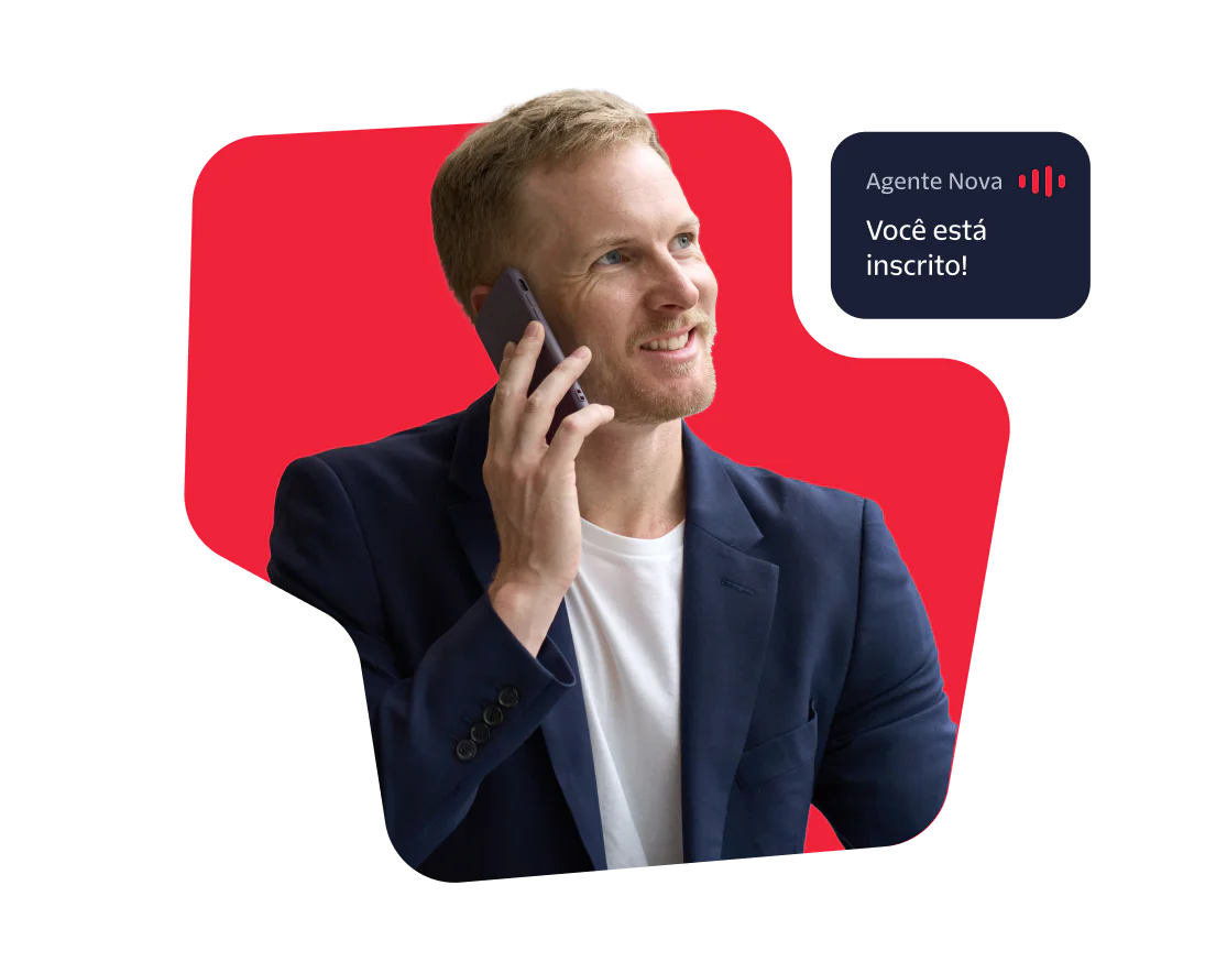Smiling man in a blue blazer on a phone call with a booking confirmation message.